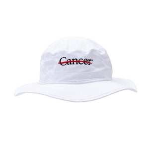 White brim hat featuring the black cancer strikethrough logo.