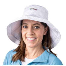 MD Anderson employee wearing a white bucket hat featuring the black cancer strikethrough logo in the middle.