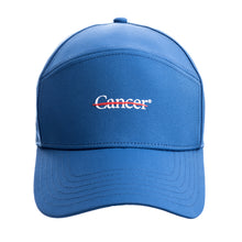 Blue cap featuring the white cancer strikethrough logo in the middle.