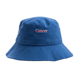 Blue bucket hat featuring the white cancer strikethrough logo in the middle.