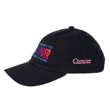 Side view of black cap featuring the white cancer strikethrough logo on the side.
