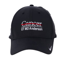 Black Nike logo cap featuring the full white UT MD Anderson logo on the front and the Nike swoosh on the visor.