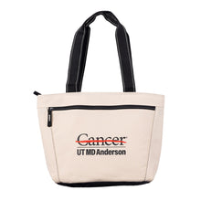 Cooler tote in natural color featuring black straps and the full black UT MD Anderson logo printed on the front zippered pocket.