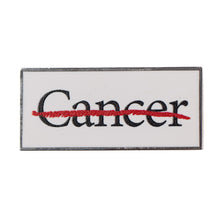 Lapel pin featuring the cancer strikethrough logo.