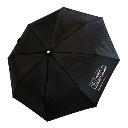 Black umbrella featuring the white MD Anderson logo.