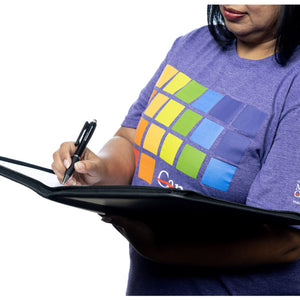 MD Anderson employee holding the black Pedova padfolio and the black ballpoint pen featuring the white MD Anderson logo.