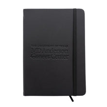 Black journal featuring the engraved MD Anderson logo.