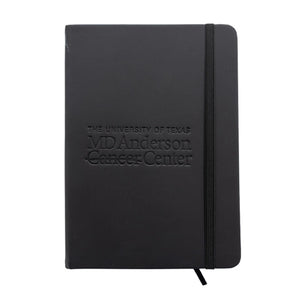 Black journal featuring the engraved MD Anderson logo.