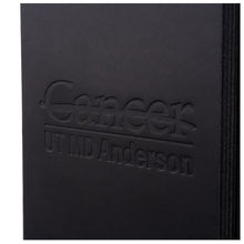 Closeup of embossed UT MD Anderson logo.