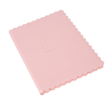 Pink scalloped journal with the debossed UT MD Anderson logo.