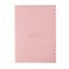 Pink scalloped journal with the debossed UT MD Anderson logo.