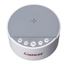White Bluetooth sound machine with a speaker top, featuring the black cancer strikethrough logo, The front control panel includes clearly labeled buttons for power, sleep mode, play/pause, timer, light, volume up and down, and Bluetooth connectivity.