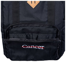 Closeup to front pocket of backpack.