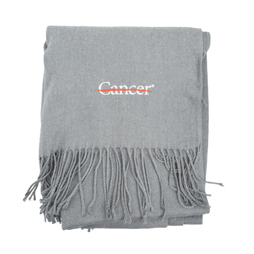 Gray pashmina shawl featuring the white cancer strikethrough logo on the bottom corner.