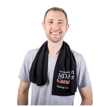 MD Anderson employee sporting a black cooling towel featuring the full white MD Anderson logo on the bottom.