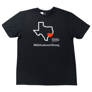 black shirt featuring a white outline of the map of Texas with a heart on Houston, accompanied by the white MD Anderson logo and the hashtag #MDAndersonStrong.